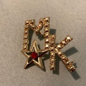 MK Brooch